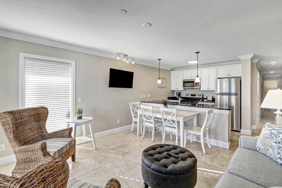 Living Room/kitchen - Bright, modern oceanfront retreat just steps from the pool—designed for effortless coastal living.