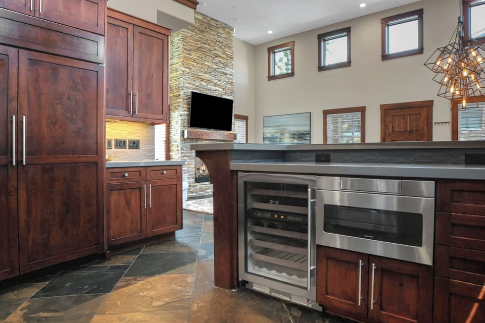 Vacation rental kitchen with undermount microwave.