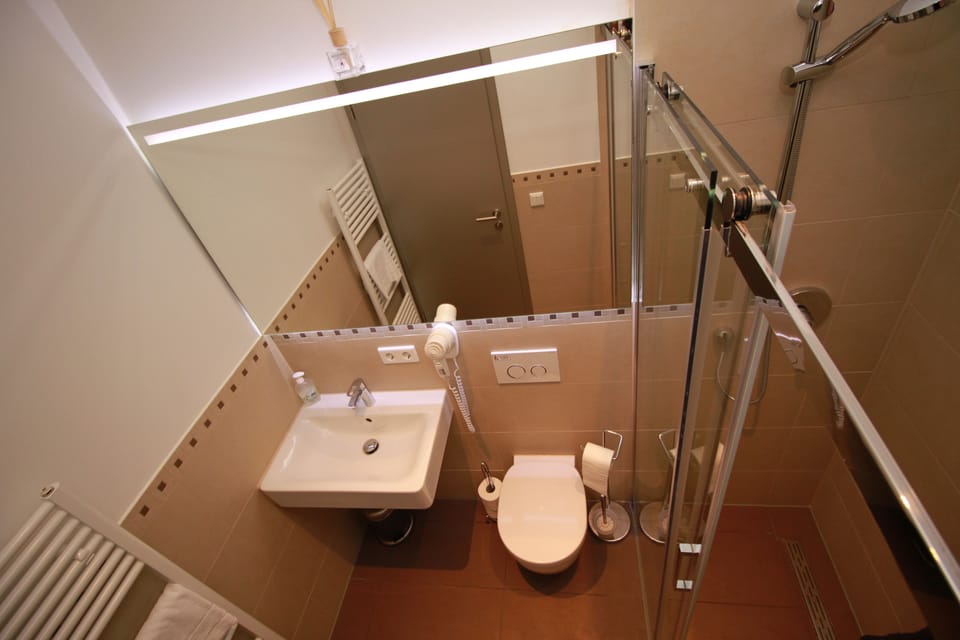 Quadruple Room, Kitchenette | Bathroom | Shower, hair dryer, towels