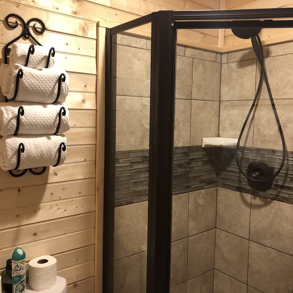 Shower in the bathroom off the kitchen.