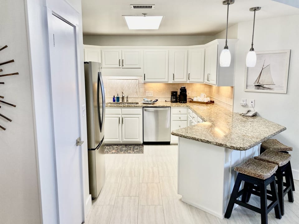 Newly painted kitchen cabinets and new light fixtures!