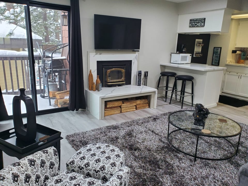 Livingroom looking out to balcony with BBQ