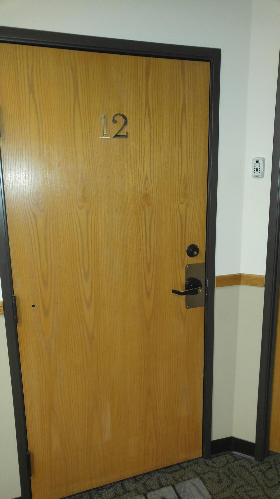 Condo door with lockbox on the right. Ill send you a code for your stay.