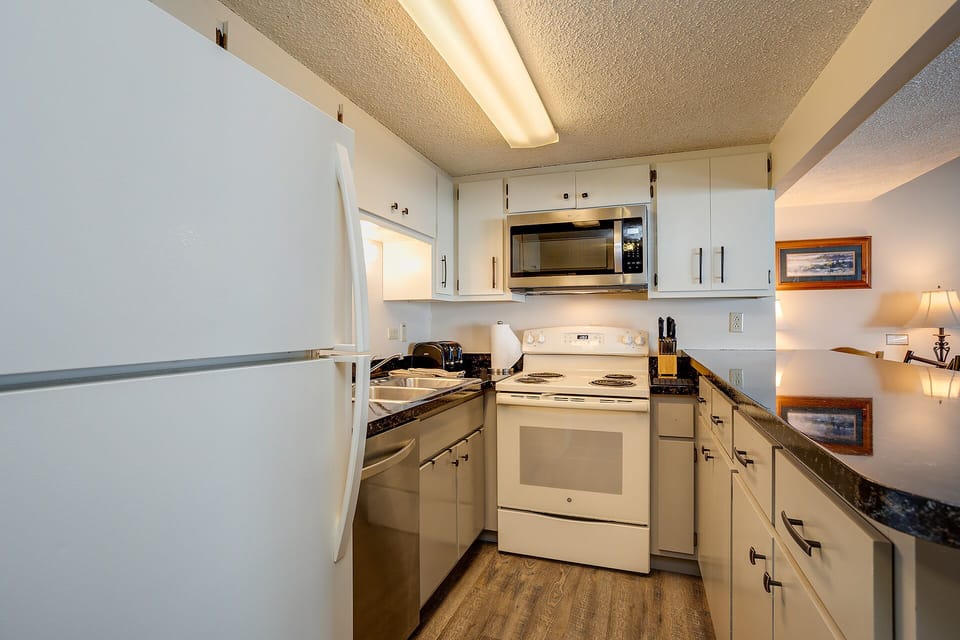 Your fully equipped kitchen awaits with modern appliances, granite countertops, and everything needed to create memorable meals during your stay.