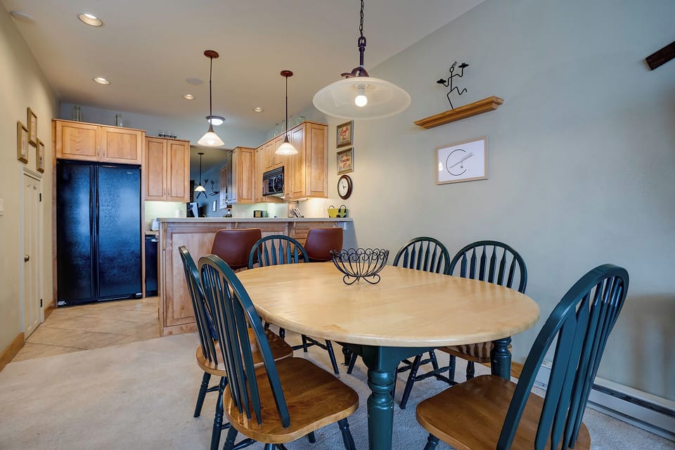 Gather around your spacious dining table with room for everyone, while the open kitchen invites easy meal prep and conversation.