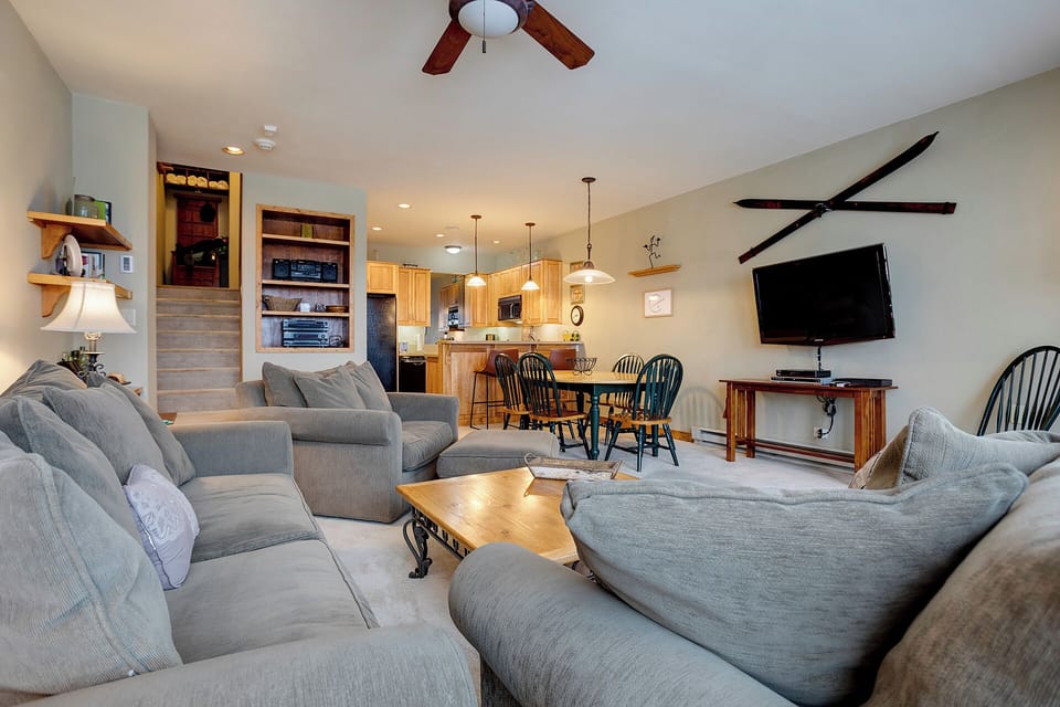 Sink into plush gray sectionals while enjoying your open-concept retreat with full kitchen, cozy dining nook, and entertainment center.
