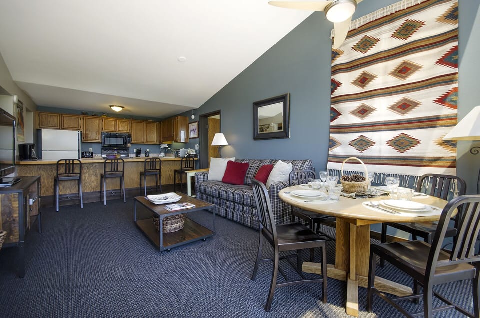 Your cozy mountain retreat combines a full kitchen, dining space, and living room where you can unwind after adventure-filled days.