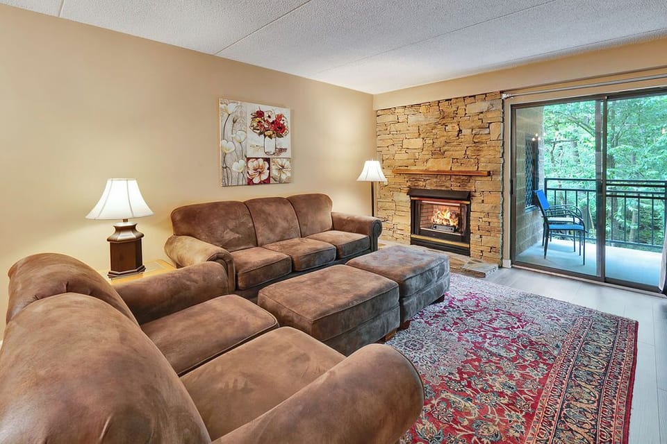 Each unit has a gas fireplace - The living area has access to the balcony overlooking the river.  The cozy fireplace is  welcomed warmth in the winter months.