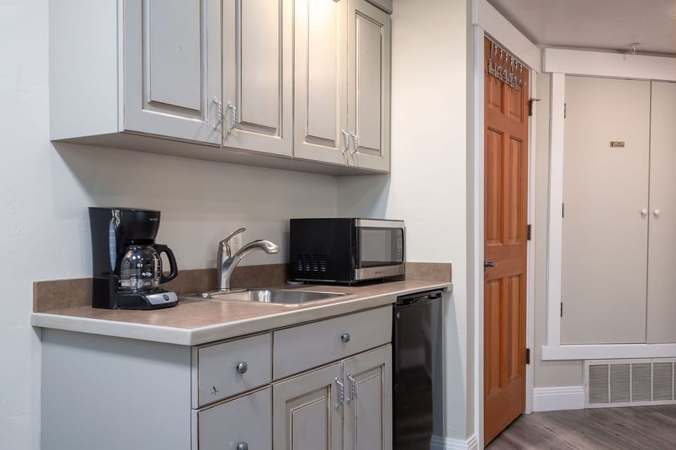 Mini fridge, microwave, toaster oven, and coffee maker