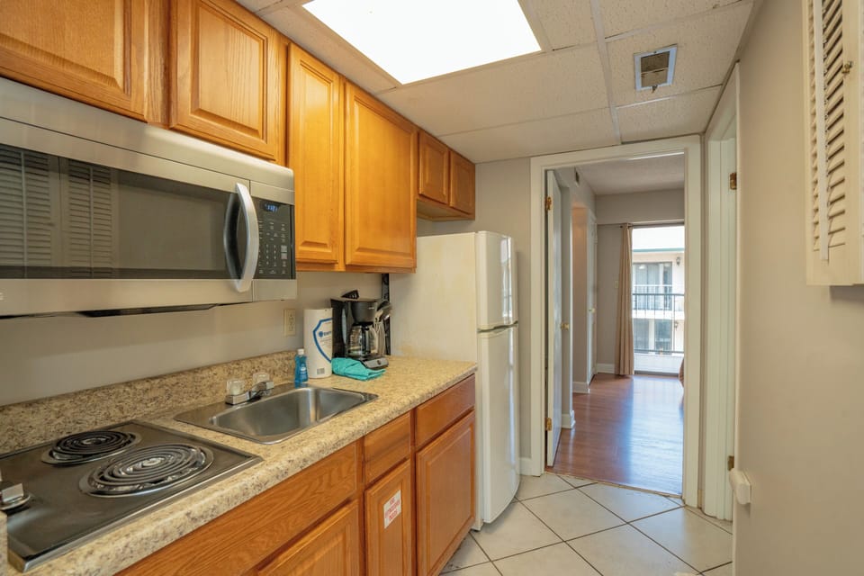 A bright, fully equipped kitchen awaits you with everything needed to prepare your favorite meals during your stay.