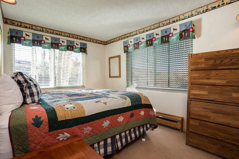 Cozy up in your rustic retreat with charming lodge-themed decor and natural light streaming through your windows.