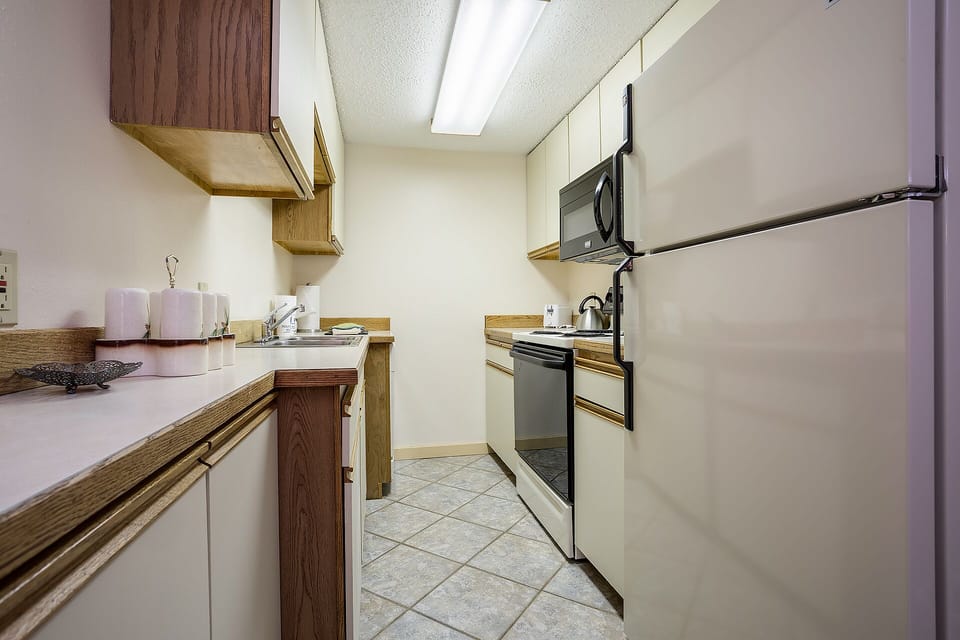 Your fully equipped galley kitchen features modern appliances and ample counter space for preparing memorable meals during your stay.