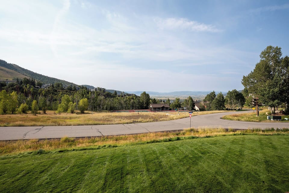 Peaceful mountain community setting with rolling hills and scenic landscapes surrounding the property area.