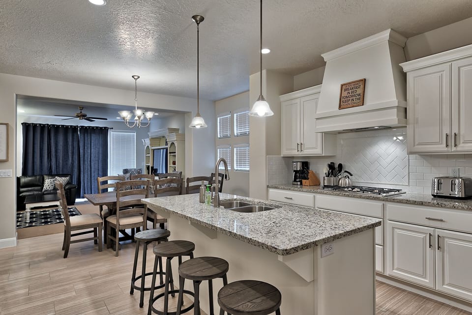 Kitchen Island & Dining Table - The Kitchen Island comfortably seats 4 adults and creates a great space for serving and preparing meals.