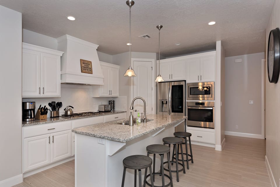 Kitchen - The Kitchen is complete with everything you will need for meal preparations including pots, pans, baking dishes, plates, cups, silverware, cutlery, and an assortment of cooking utensils.