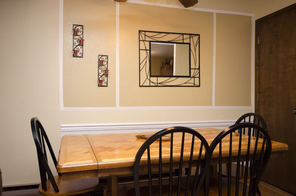 Gather around this charming dining table where your group can share meals and make memories together in comfort.