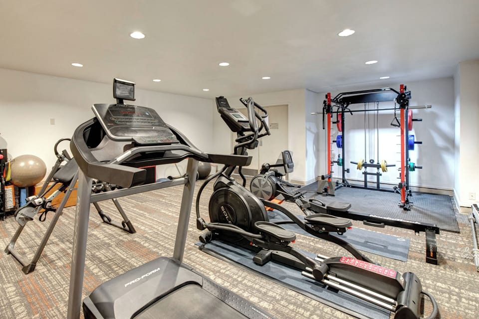 Your private fitness center features modern cardio and strength training equipment, perfect for maintaining your workout routine during your stay.