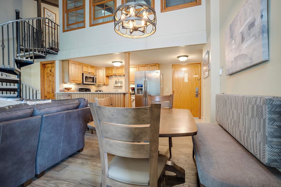 Unwind in your stylish open-plan retreat with vaulted ceilings, designer lighting, and a spiral staircase leading to your private loft sanctuary.