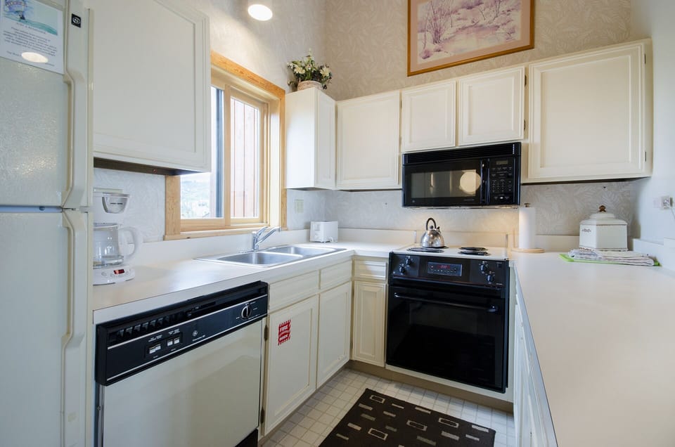 Your fully equipped kitchen awaits with modern appliances, ample counter space, and everything needed to prepare meals during your stay.