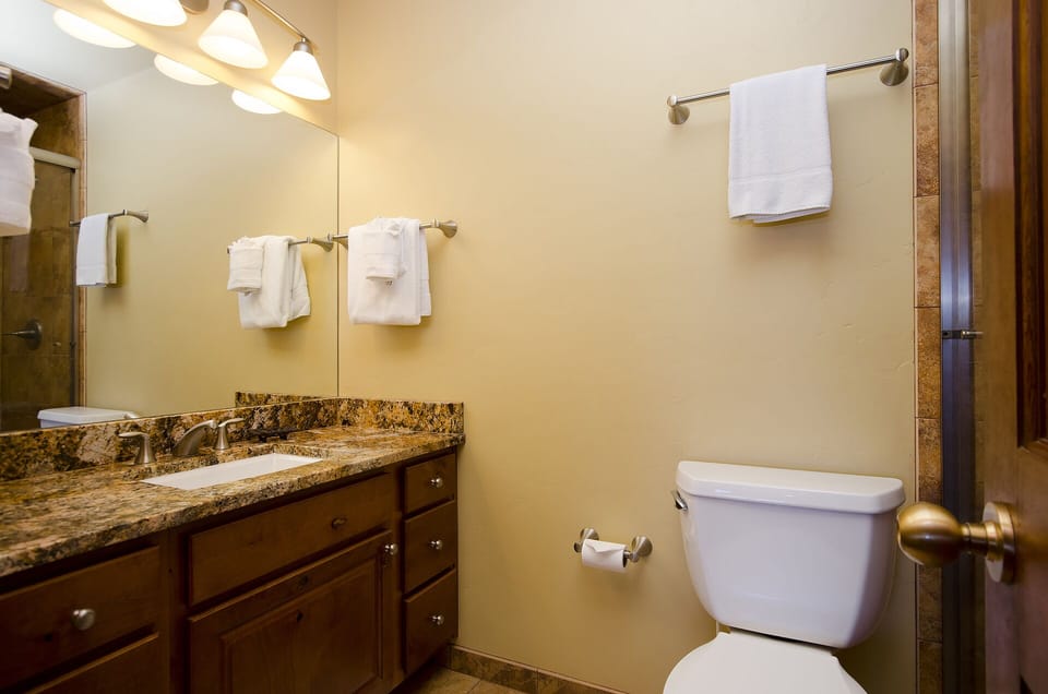 Your private bathroom features a granite vanity, fresh towels, and thoughtful amenities to help you start and end each day feeling refreshed.