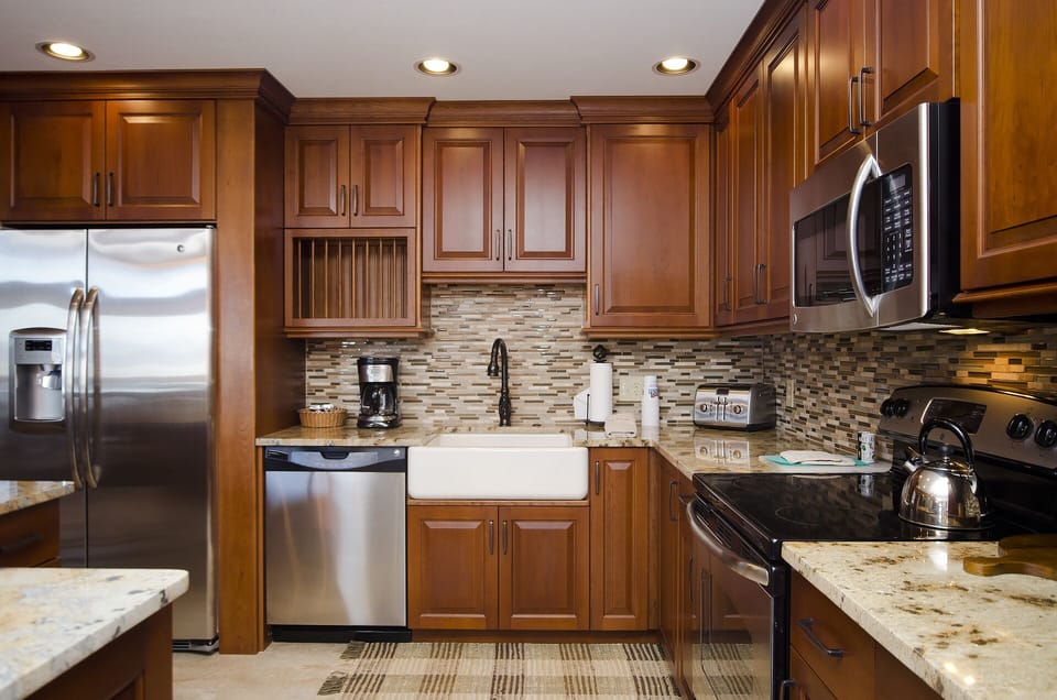 Step into your gourmet kitchen featuring rich cherry cabinets, granite counters, and premium stainless appliances—perfect for creating memorable meals together.