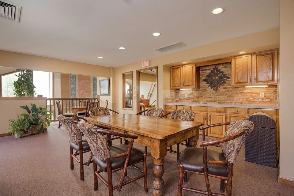 Gather around this warm dining space with rustic charm and modern comfort for memorable meals together.