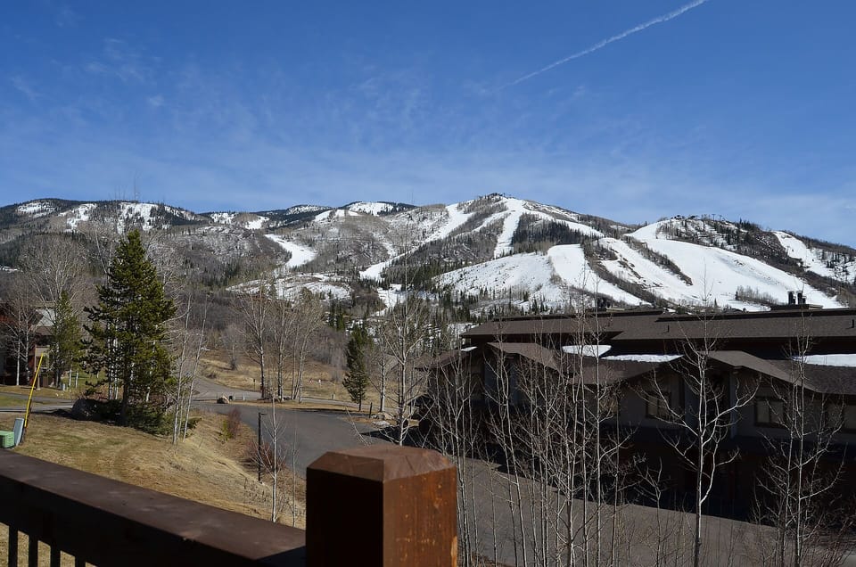 Stunning mountain views showcase snow-covered ski slopes and pristine winter landscape from this elevated vantage point.
