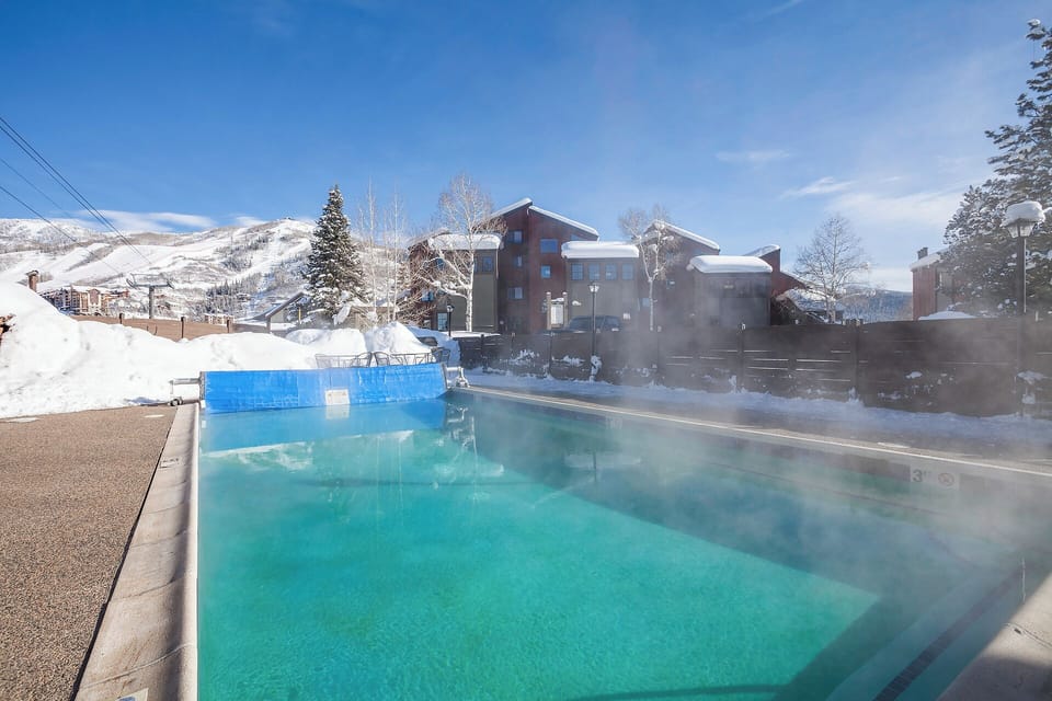 Soak in the heated outdoor pool surrounded by snow-capped mountains and crisp winter air for an unforgettable alpine experience.