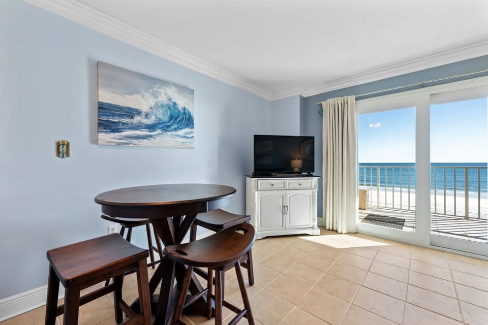 Sip your morning coffee at your dining table while gazing at endless ocean views through floor-to-ceiling windows.