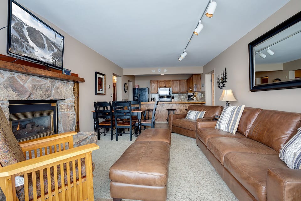 Sink into plush leather seating by your cozy stone fireplace, with an open kitchen perfect for après-ski meals.