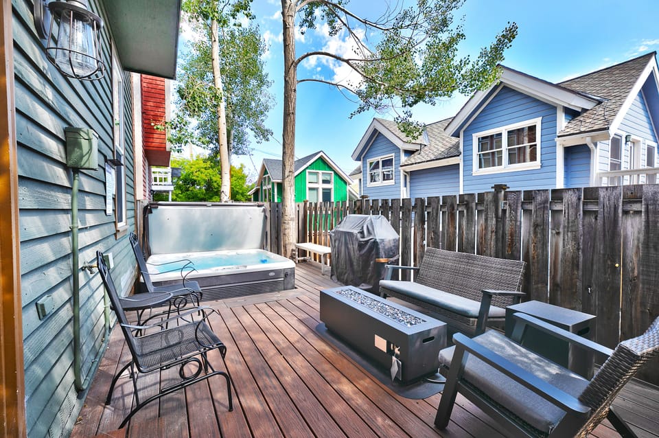 Your patio sanctuary right in the heart of old town, wooden deck with wooden privacy fence, hot tub and patio seating