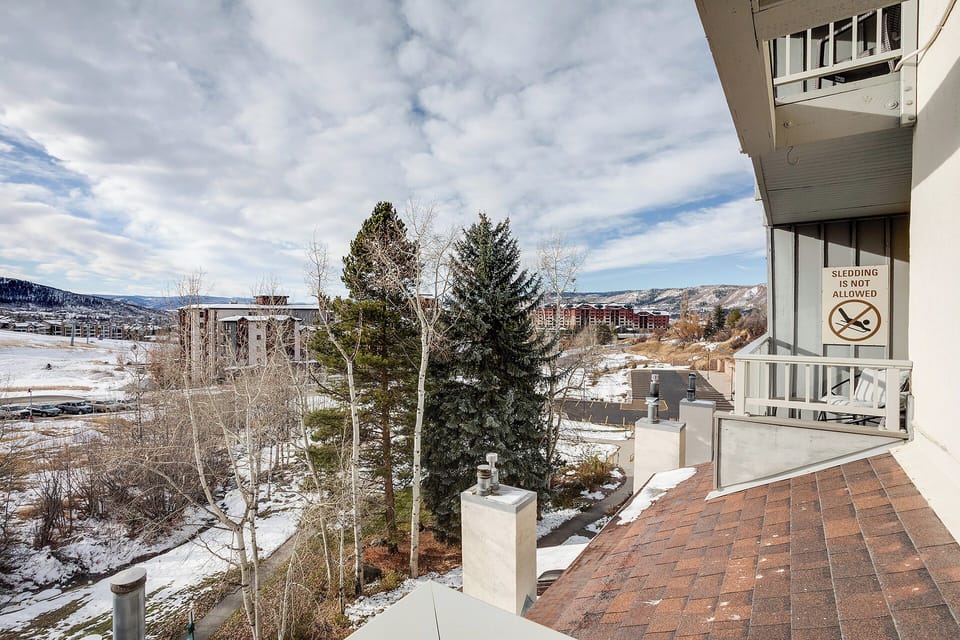 Mountain views stretch across snow-dusted landscapes from this peaceful terrace, perfect for morning coffee or evening relaxation.
