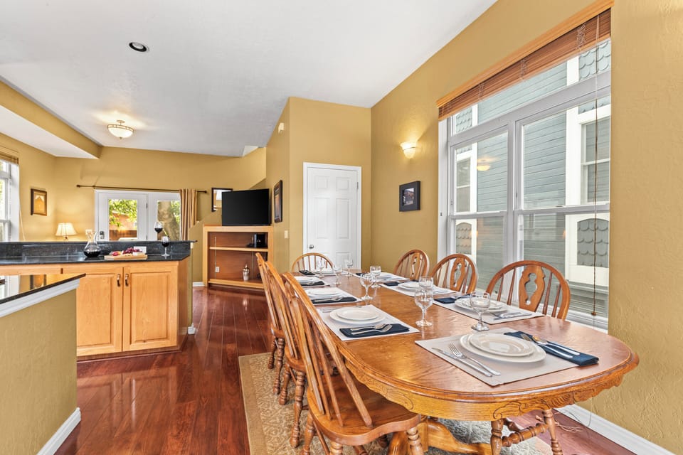 The wooden dining table offers seating for 8.