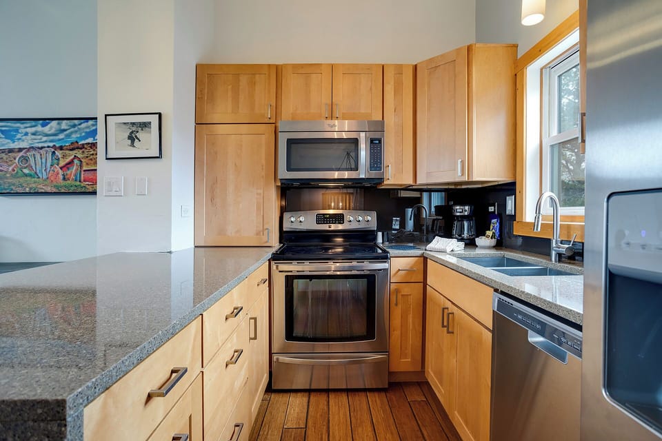 Your fully equipped kitchen awaits with granite countertops, stainless steel appliances, and everything needed to create memorable meals during your stay.