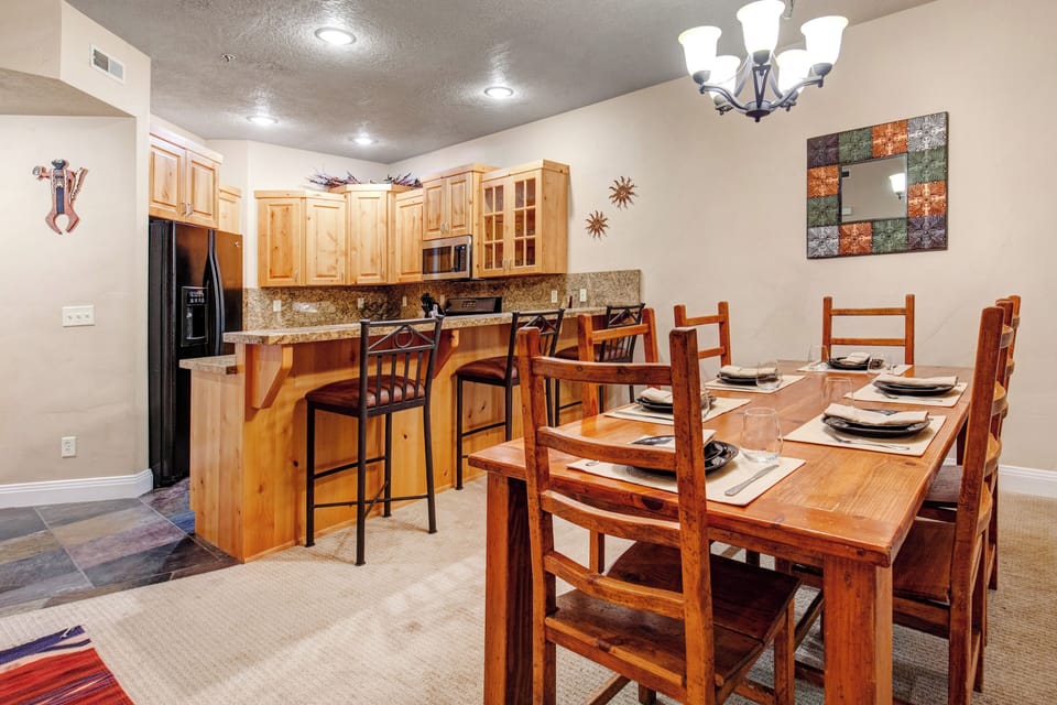 Gather around the dining table set for eight, or grab a seat at the breakfast bar in your fully-equipped kitchen—perfect for memorable meals together.