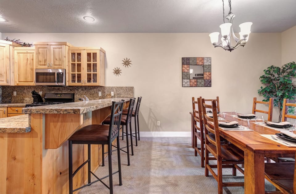 Picture yourselves cooking together in this inviting kitchen, then gathering around the warm wood table for meals and laughter, making memories in a space designed for connection and comfort.