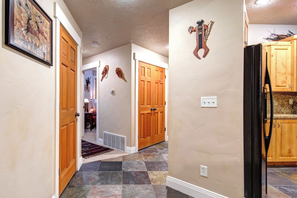 Step into your private retreat through this welcoming hallway, where warm wood tones and unique décor set the tone for your mountain getaway.