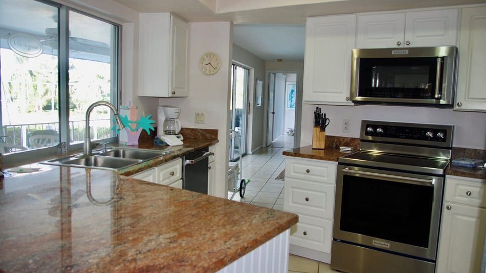 Fully-equipped kitchen with water views.
