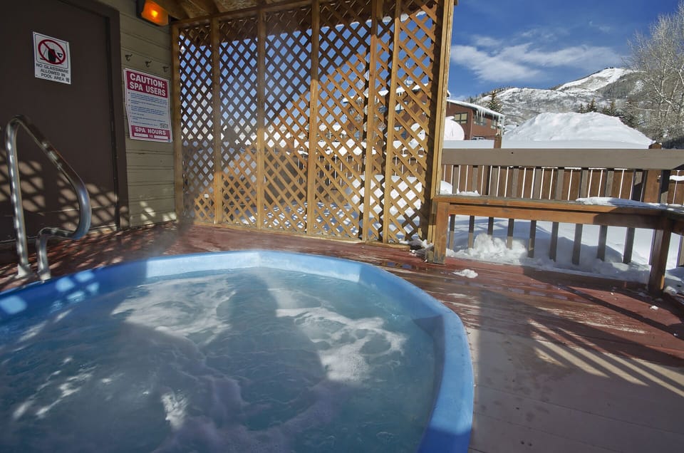 Soak in the bubbling hot tub while snow-capped mountains create your perfect winter backdrop. Pure mountain bliss awaits.