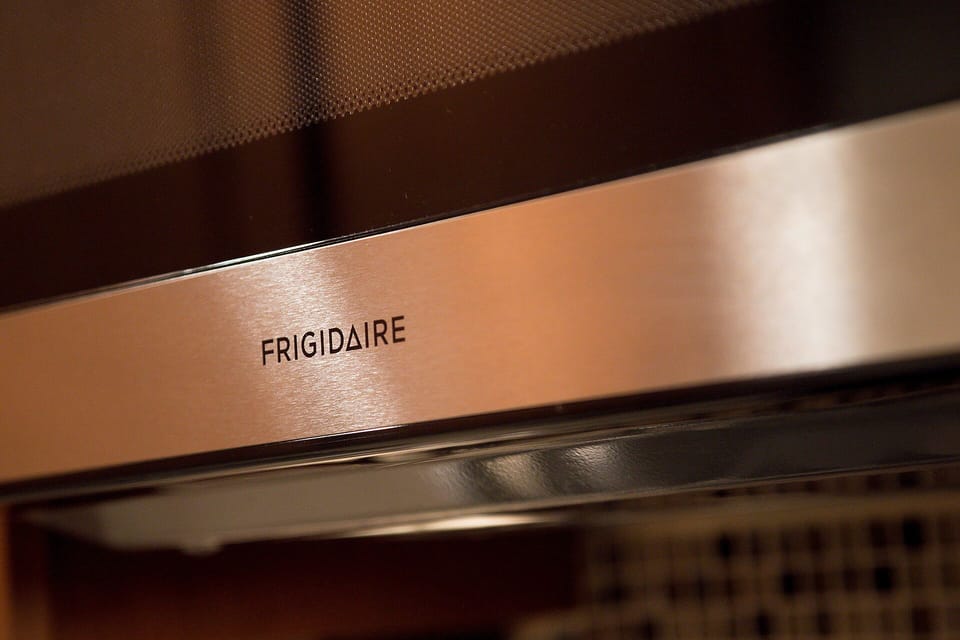 Your kitchen features a sleek Frigidaire range hood that keeps the air fresh while you cook your favorite meals.