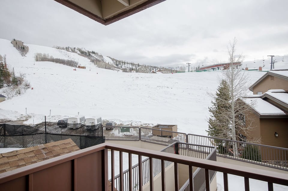 Step onto your private balcony and breathe in the crisp mountain air while gazing at pristine ski slopes just beyond your door.