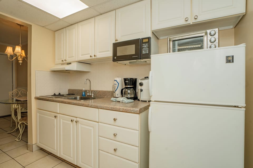 Your fully equipped kitchenette has everything you need to prepare light meals and snacks during your stay, with a microwave, toaster oven, and coffee maker ready for your convenience.