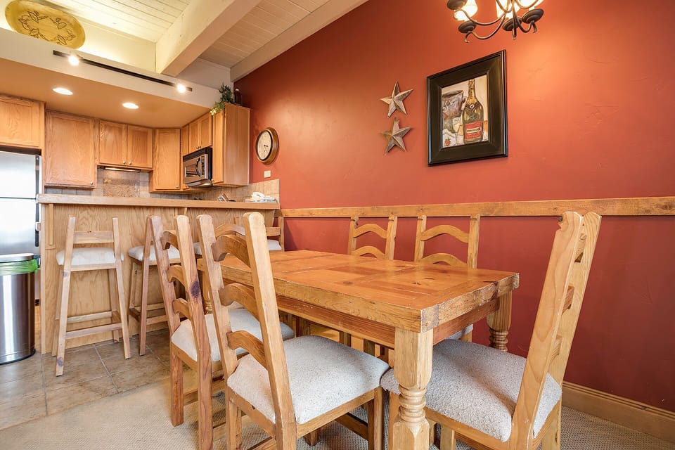 Your welcoming kitchen and dining space features warm wood furnishings and a rustic charm perfect for family meals.