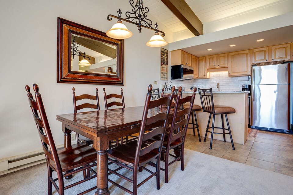 Gather around your elegant dining table for memorable meals, with an open kitchen nearby for easy entertaining.