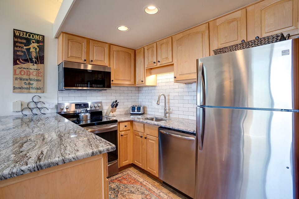 Your fully equipped kitchen features granite counters, stainless appliances, and everything needed for memorable mountain meal prep.