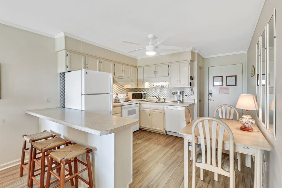 Beachwood Place 2G- Kitchen - Newly renovated villa - bright white kitchen with full sized appliances.  Great spot to have breakfast at the peninsula!