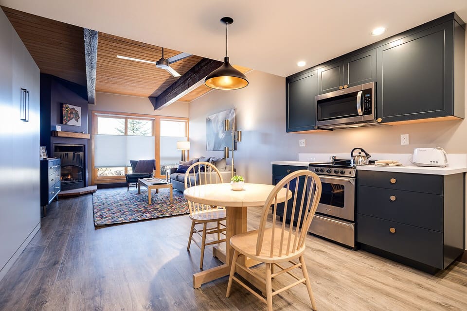 Your open-concept space blends kitchen, dining, and living areas seamlessly. Cook meals in your modern kitchen then gather around the cozy fireplace.