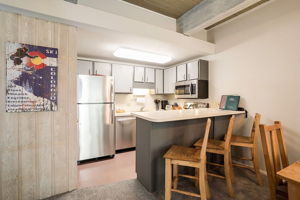 Your spacious kitchen features modern appliances and a breakfast bar where you can enjoy morning coffee together.