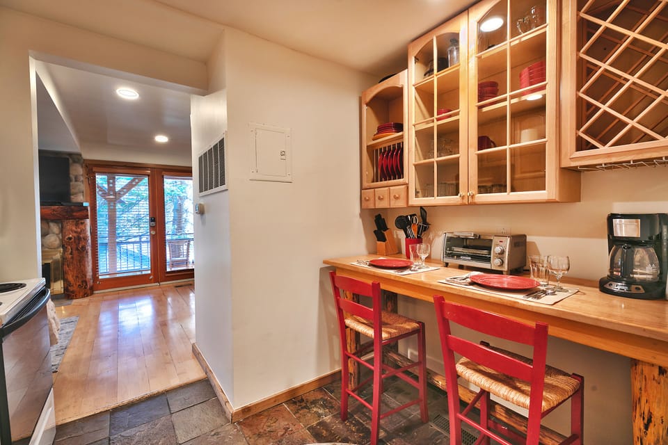 Cozy dining nook with seating for 2 in wooden barstools