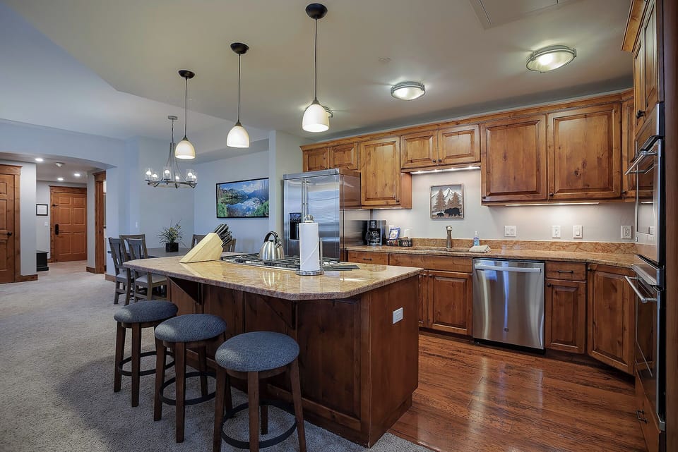 Your gourmet kitchen awaits with rich wood cabinetry, granite countertops, and stainless steel appliances for memorable meal preparations.
